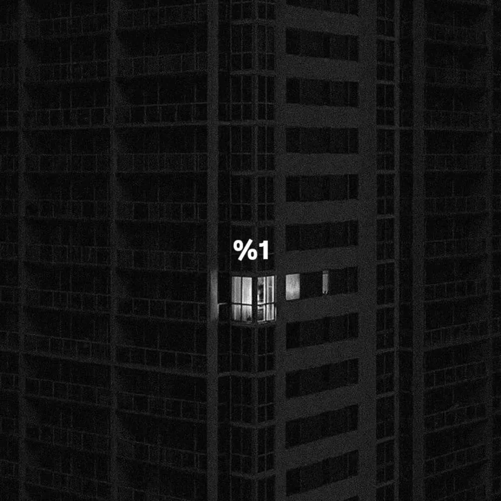 Single lit window in a dark tower